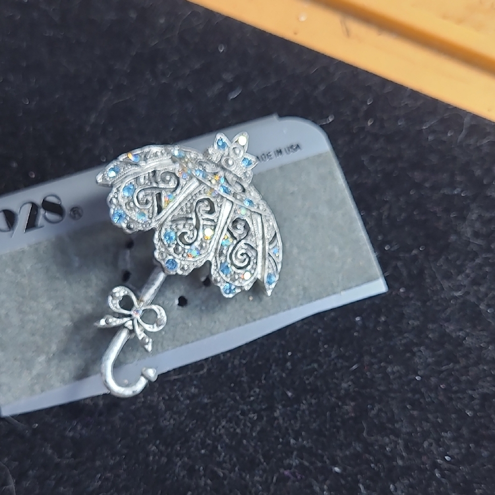 1928 Elegant Silver and Blue Umbrella Brooch